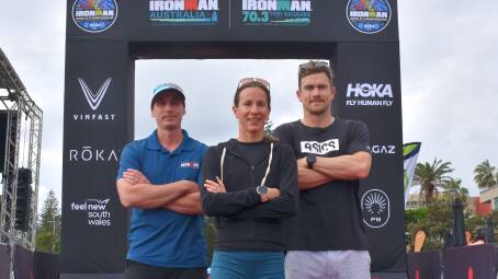 (L-R) Ironman Australia regional director Carl Smith with professional Triathletes Radka Kahlefeldt and Mike Phillips. Picture by Mardi Borg
