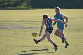 Magpies' young gun Braedon Fuller kicks on his non-prefered foot (left) in their clash against the Coffs Harbour Breakers. Picture by Emily Walker