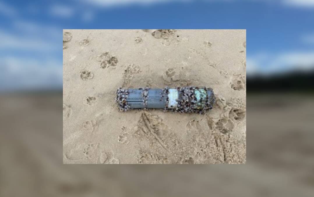 Paw prints around the device found by dog walkers on Lighthouse Beach. Picture supplied by Mid North Coast Police