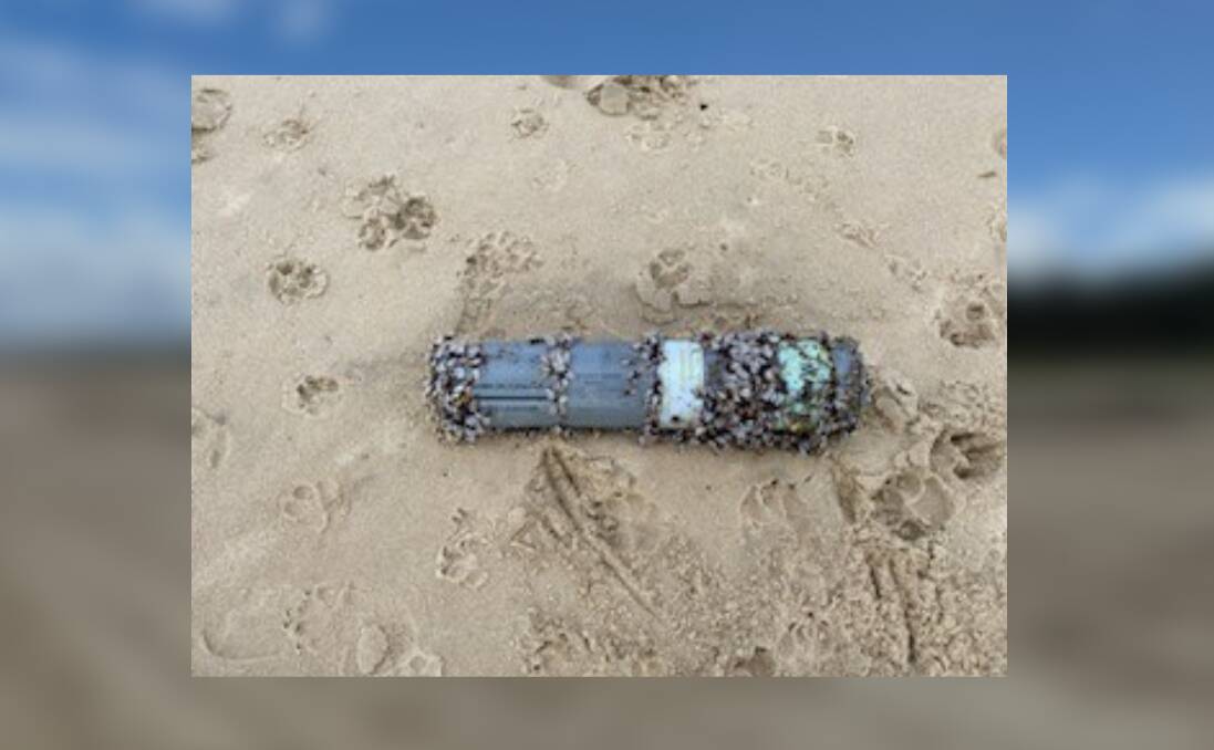 Paw prints around the device found by dog walkers on Lighthouse Beach. Picture supplied by Mid North Coast Police