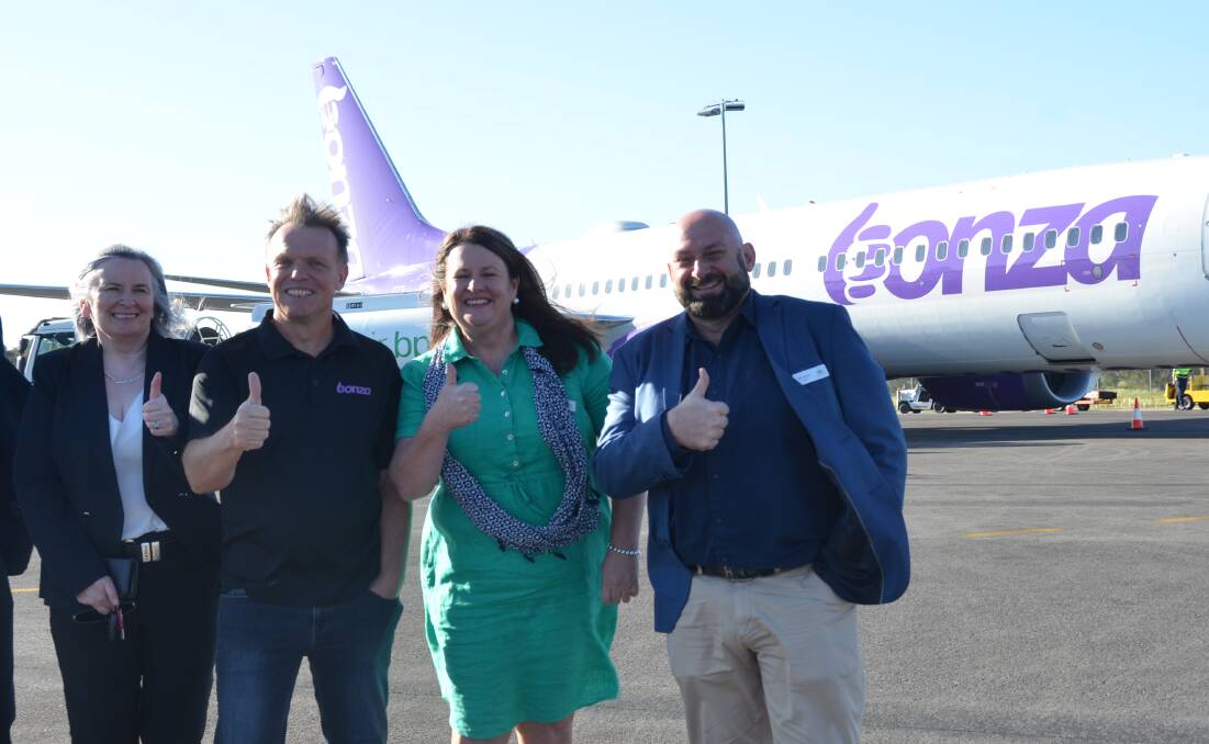 Port Macquarie-Hastings Council CEO Dr Clare Allen, Bonza CEO Tim Jordan and councillors Danielle Maltman and Nik Lipovac, were on the tarmac as visitors arrived. Picture by Emily Walker 