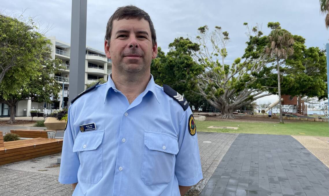 Port Macquarie SES Leading Senior Operator, Michael Ward, stands in front of the town green fig tree which was split in half during February's wild storm. Picture supplied