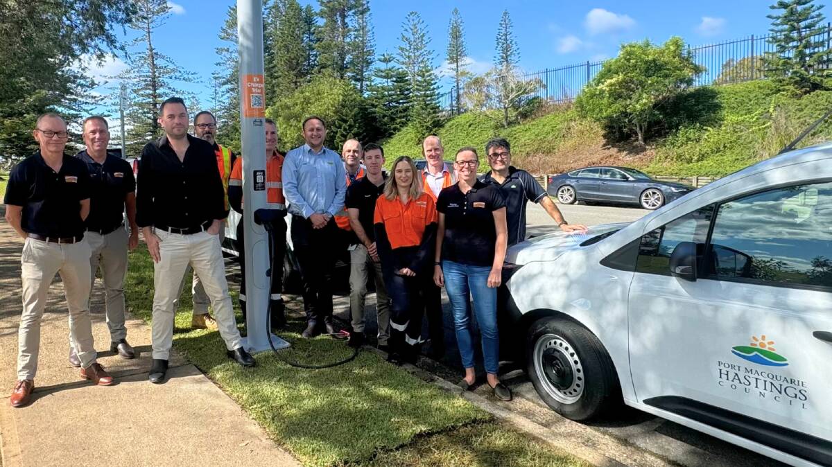 Representatives from Essential Energy, EVX and Wagners Composite Fibre Technologies (CFT) with new streetlight electric vehicle (EV) charger. Picture by Abi Kirkland