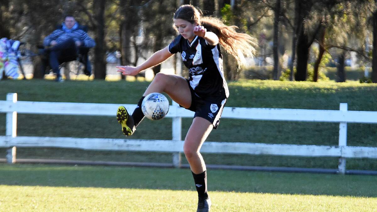 Ginger Harrison playing for Mid Coast in a Northern NSW Women's Premier League match. Football Mid North Coast hopes to start a Women's Zone Premier League next year.