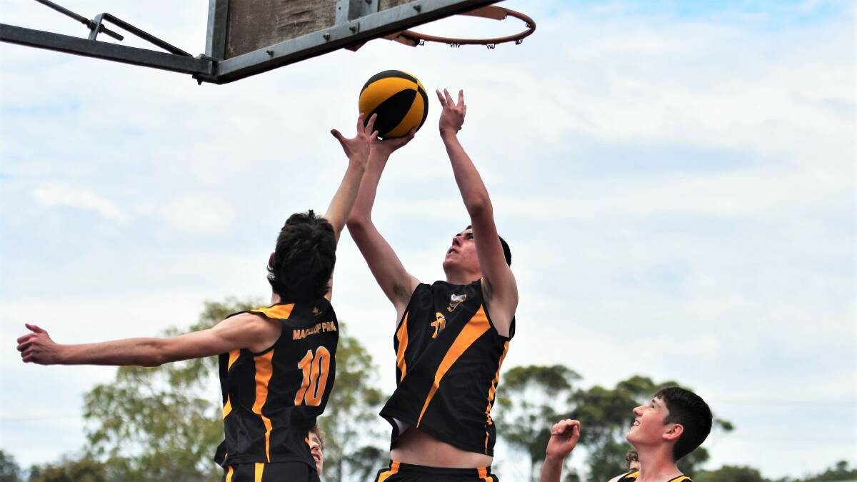 Xavier Proud (right) and Toby Harper in action for MacKillop as they train ahead of their national basketball title tilt on the Gold Coast. Picture by Paul Jobber