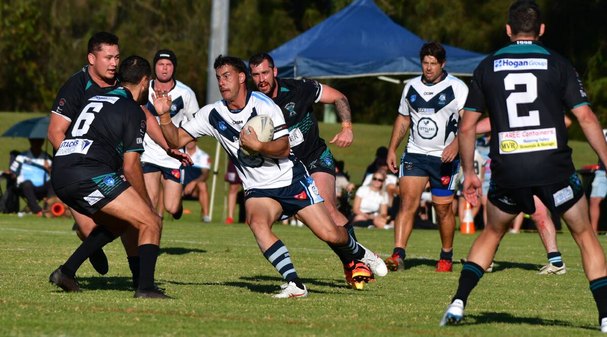 Breakers winger Cody Robbins takes the ball into the Taree defence.