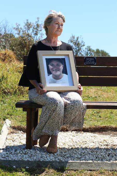 Cheryl Roberts holds a picture of her late son Jack at his memorial chair. Picture by Simone De Peak