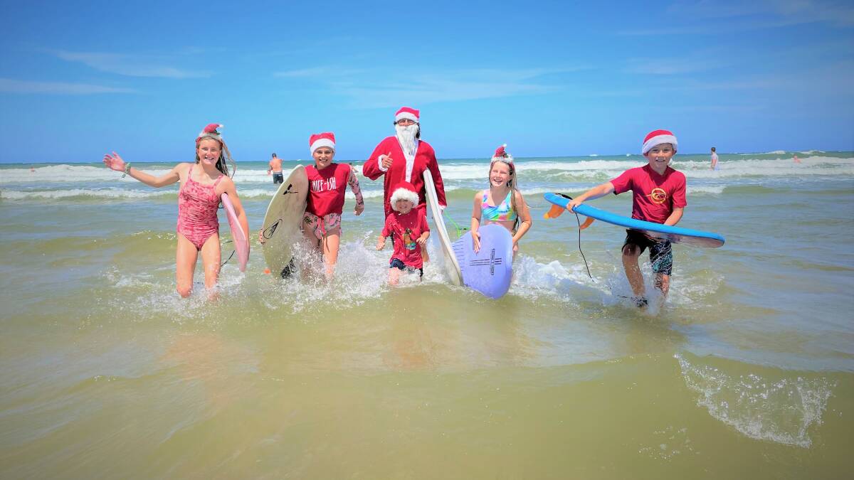 Brad Waite, Bodhi Waite, Archer Waite, Summer Waite, Annabelle Broderick and Grace Broderick were back in the waves for the annual Surfing Santas paddle out at Rainbow Beach, Bonny Hills in 2021. Picture by Tracey Fairhurst