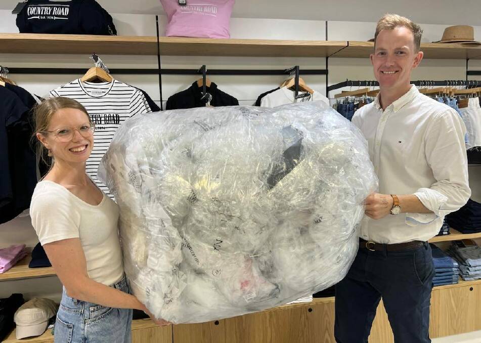 Zoe and Charlie Cull estimate they have accumulated thousands of plastic bags since the Assef's store opened in September. Picture: supplied 
