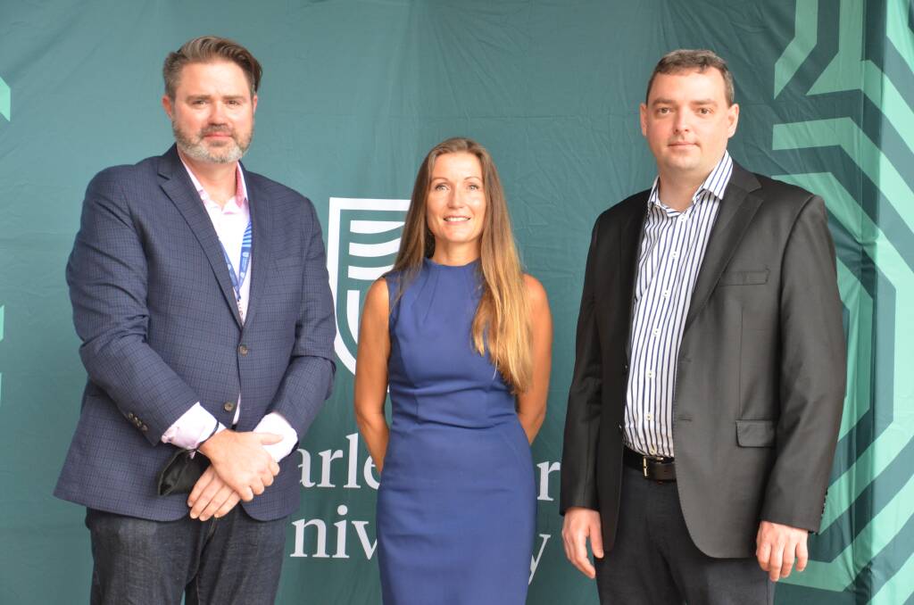 Axiom CEO Michael Reth and chief technology officer Sergey Abromisov with CSU director of external engagement in Port Macquarie Kate Wood-Foye.