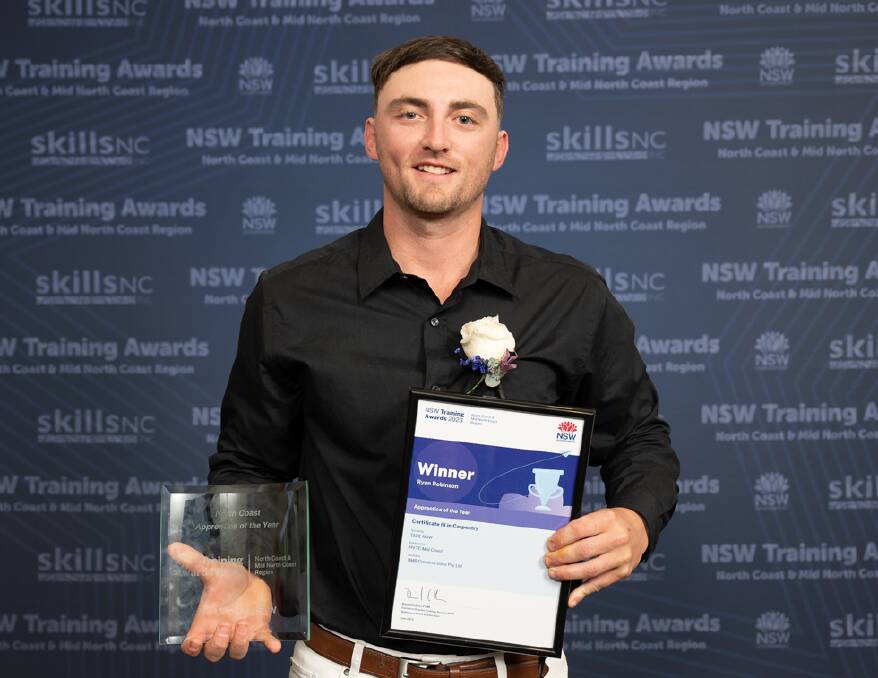 Apprentice of the Year Ryan Robinson holds his certificate and trophy from the North Coast Training Awards. Picture by Jed Grace Photography