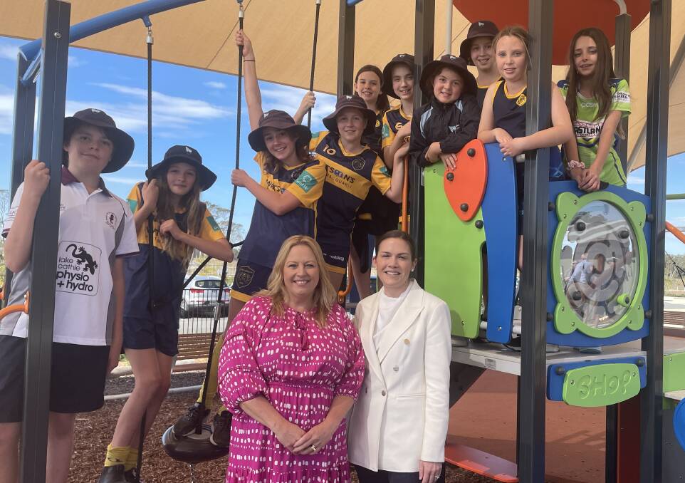 Lake Cathie Public School students test out the inclusive playground as mayor Peta Pinson and MLC Emily Suvaal look on. Picture by Lisa Tisdell
