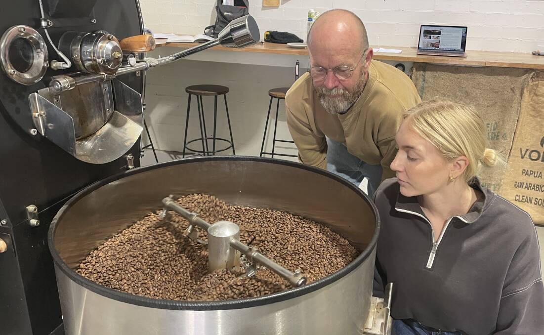 Matt Fuhrer and his daughter Caitlin from Moon Boy Roast House watch the coffee bean roasting process. Picture by Lisa Tisdell
