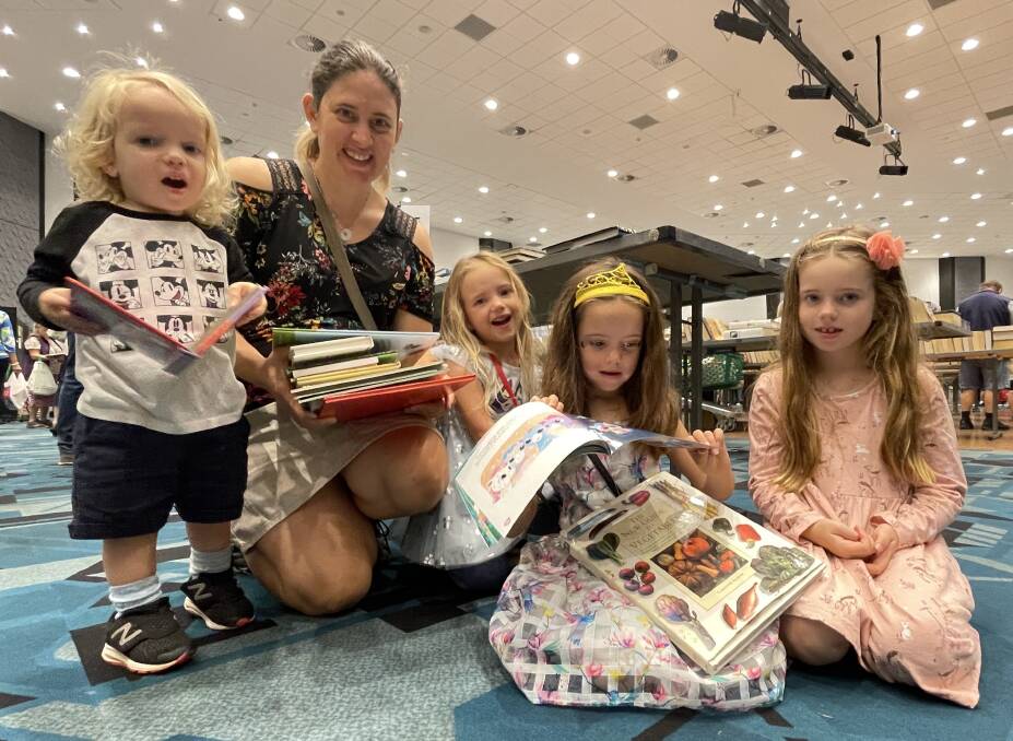 Ryan, Julie, Maika, Isla and Petra Barker support the Giant Book Sale. Picture by Lisa Tisdell
