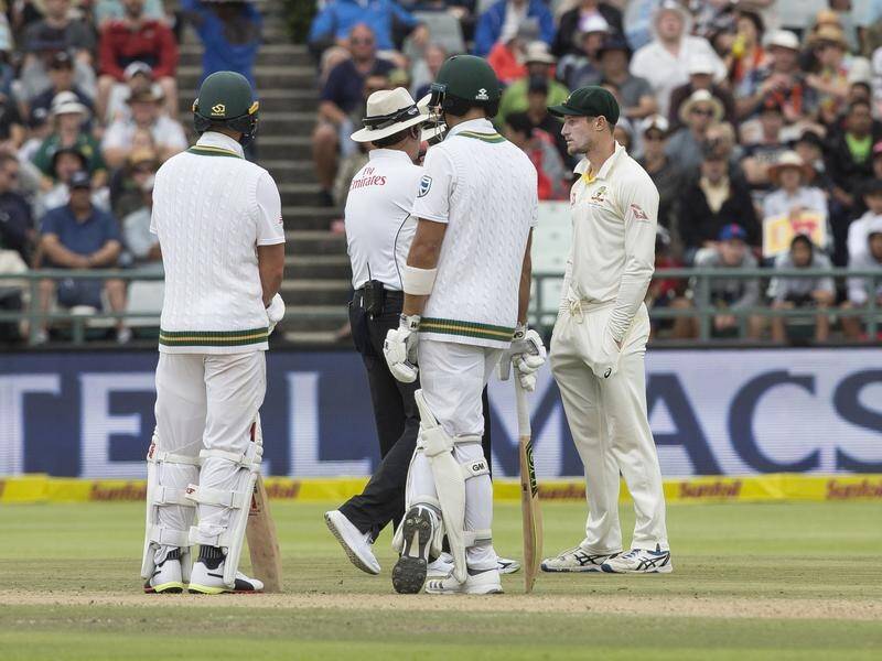 Australia's Cameron Bancroft is questioned by the umpires during the infamous Cape Town Test.